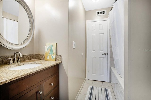 bathroom with tile patterned flooring, vanity, and shower / bath combination with curtain