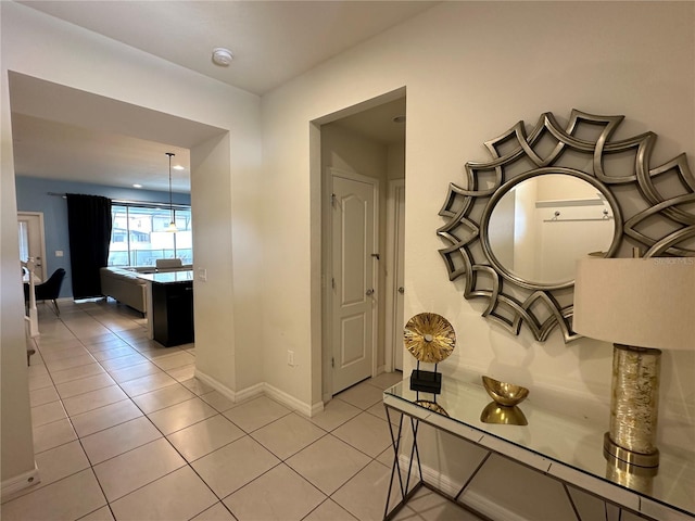 hallway with light tile patterned floors