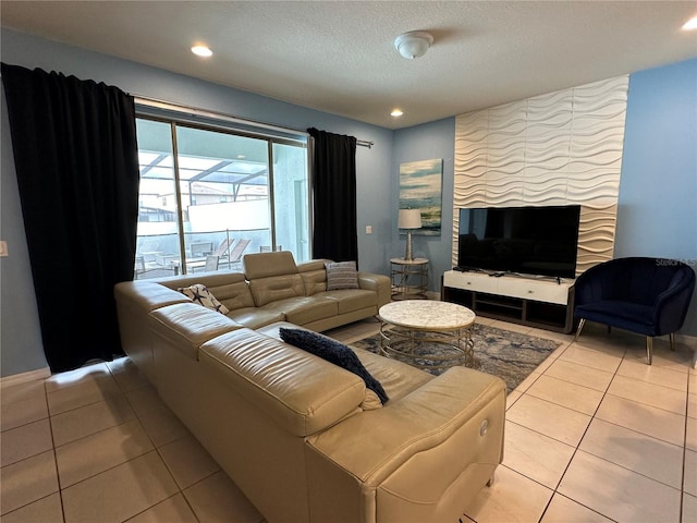 tiled living room with a textured ceiling