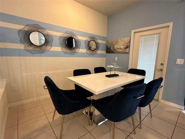 dining area with light tile patterned floors