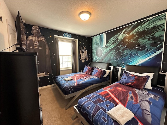 bedroom featuring carpet flooring and a textured ceiling