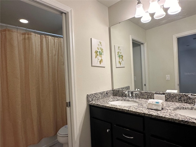 full bathroom with vanity, an inviting chandelier, toilet, and shower / bathtub combination with curtain