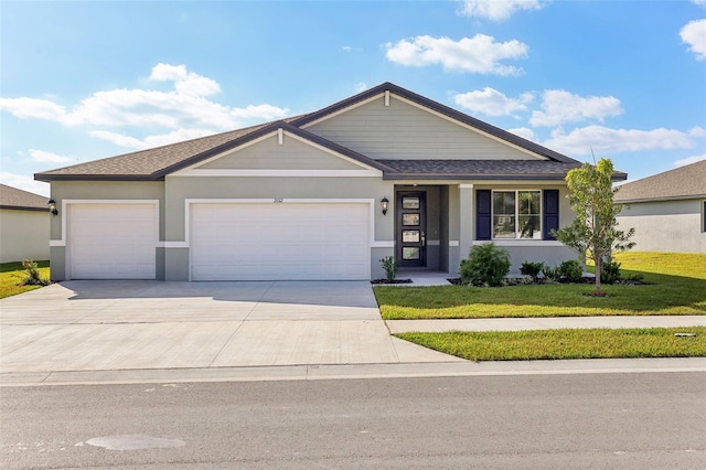 ranch-style house with a garage and a front lawn