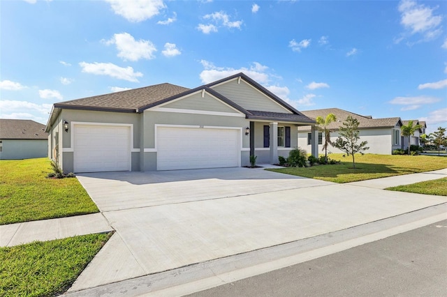 ranch-style house with a garage and a front lawn