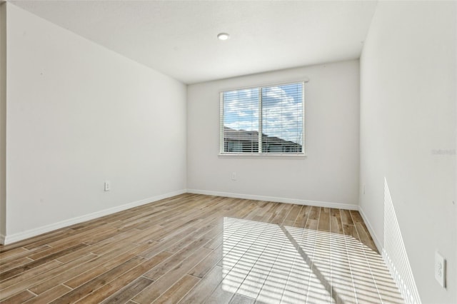 unfurnished room featuring hardwood / wood-style floors