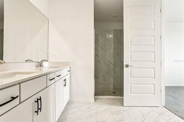 bathroom with tiled shower and vanity