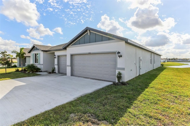 view of front of home with a garage and a front lawn