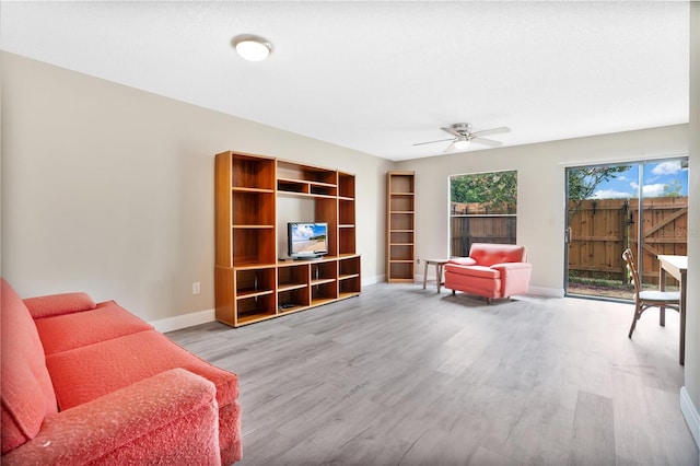 sitting room featuring ceiling fan and light hardwood / wood-style flooring