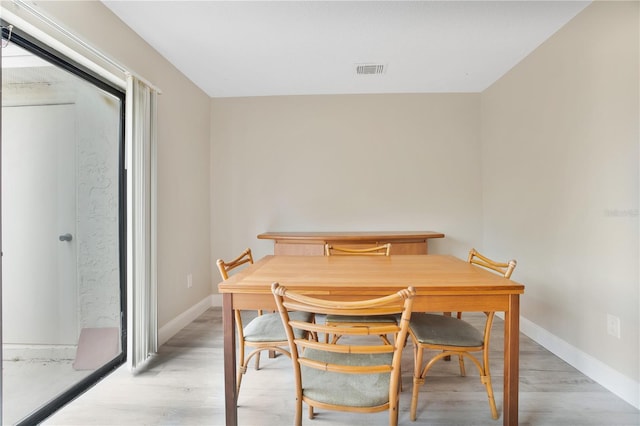 dining area with light wood-type flooring