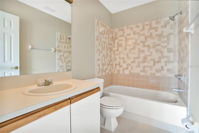 full bathroom with tile patterned floors, toilet, vanity, and tiled shower / bath