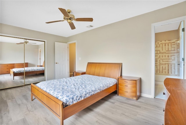 bedroom with ceiling fan, a closet, and light wood-type flooring