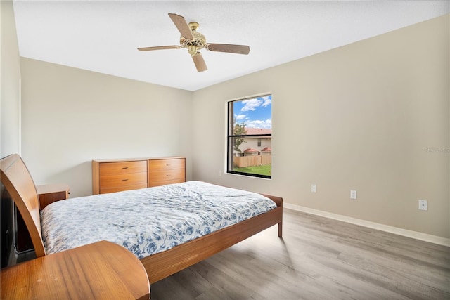 bedroom featuring ceiling fan and wood-type flooring