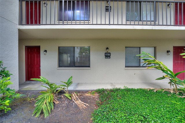 entrance to property with a balcony