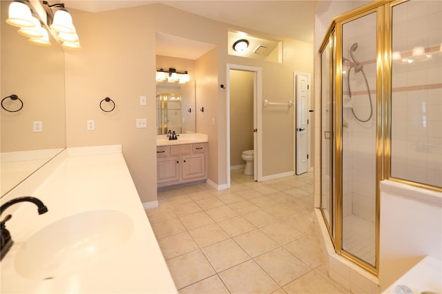 bathroom featuring a shower with door, tile patterned flooring, vanity, toilet, and a chandelier