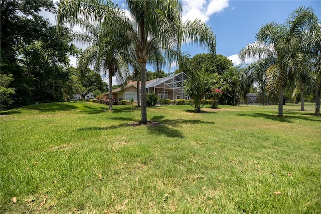 view of yard with a lanai