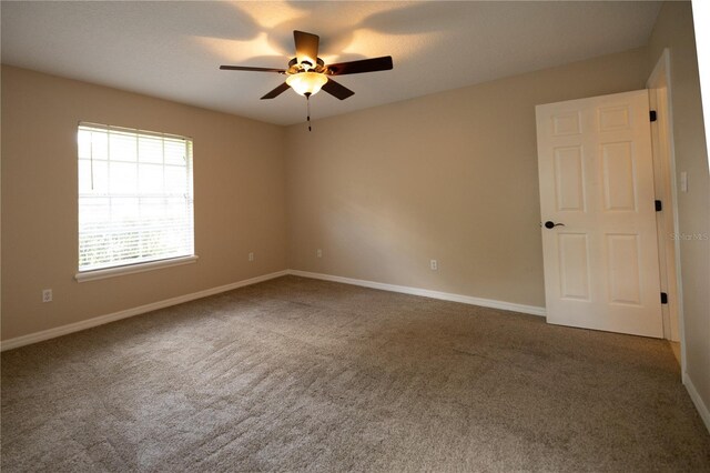 unfurnished room with carpet floors and ceiling fan