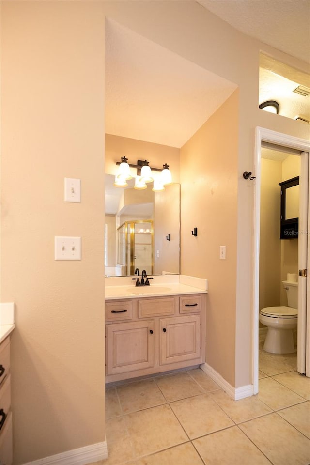 bathroom with tile patterned floors, toilet, and vanity