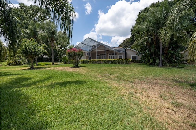 view of yard with a lanai