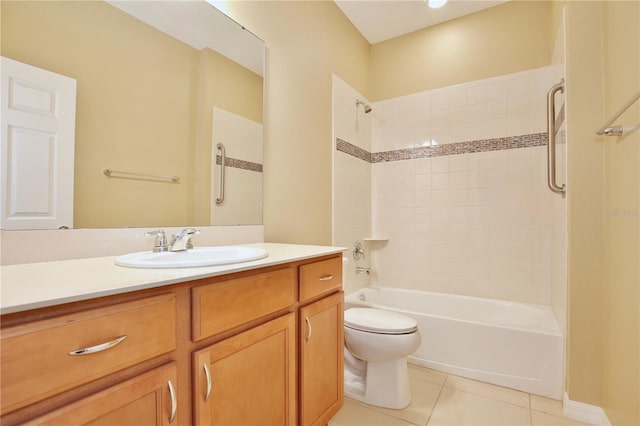 bathroom featuring vanity, toilet, and tile patterned flooring