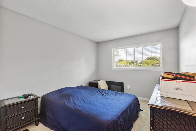 bedroom with light carpet