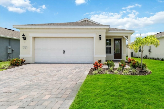 view of front facade featuring a front yard, french doors, and a garage