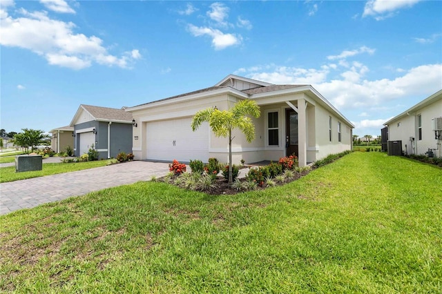 view of front of house with a garage and a front lawn