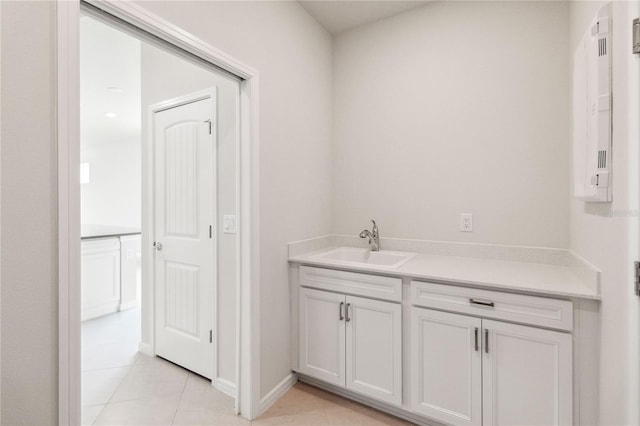 bathroom with tile patterned flooring and vanity