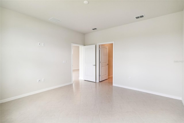 spare room with light tile patterned floors