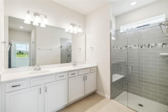 bathroom featuring tile patterned flooring, vanity, and an enclosed shower