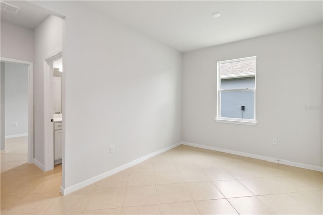 empty room with light tile patterned floors