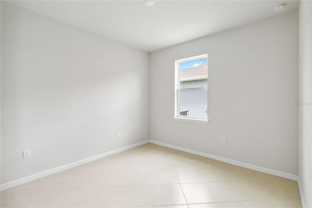 empty room with light tile patterned floors