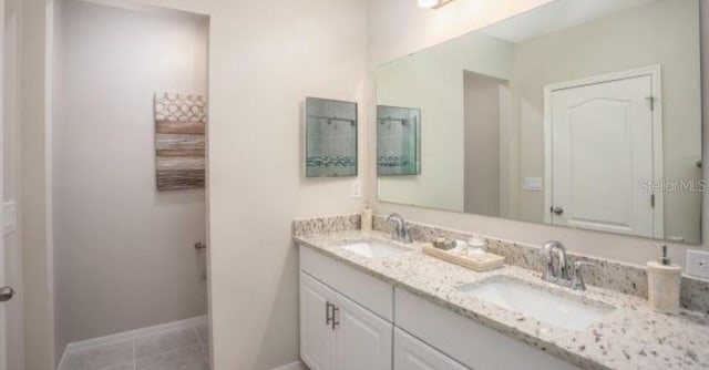 bathroom with vanity and tile patterned floors