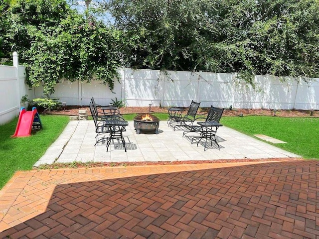 view of patio / terrace with an outdoor fire pit