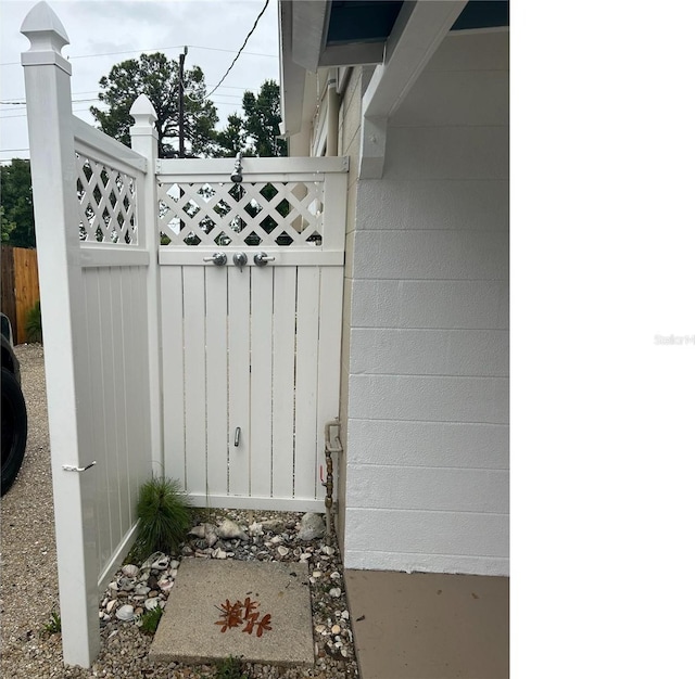 view of gate with fence