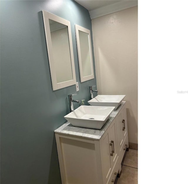 bathroom featuring baseboards, vanity, and tile patterned floors