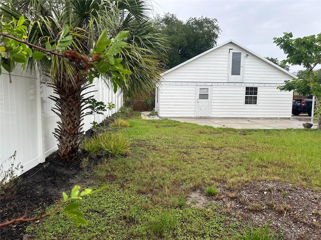 view of yard featuring a patio and fence