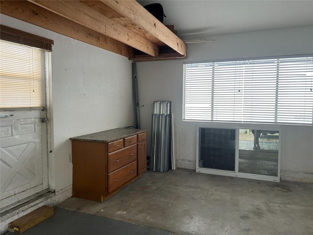 miscellaneous room featuring unfinished concrete flooring