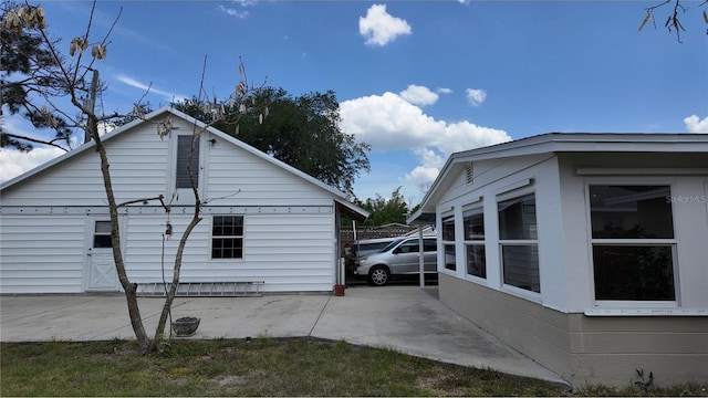 view of side of home with a patio area