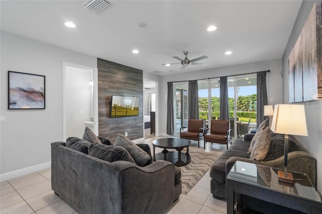 tiled living room with ceiling fan