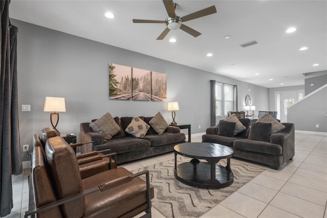 tiled living room with ceiling fan