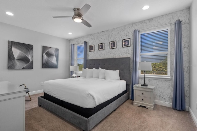 carpeted bedroom with ceiling fan