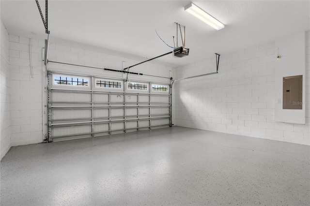 garage featuring electric panel and a garage door opener