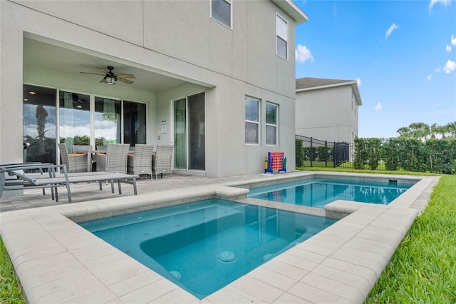 view of pool with ceiling fan and a patio area