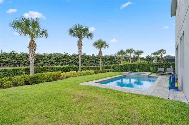 view of swimming pool with a patio area, a yard, and an in ground hot tub