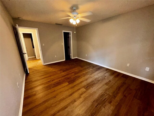 unfurnished bedroom featuring wood-type flooring and ceiling fan