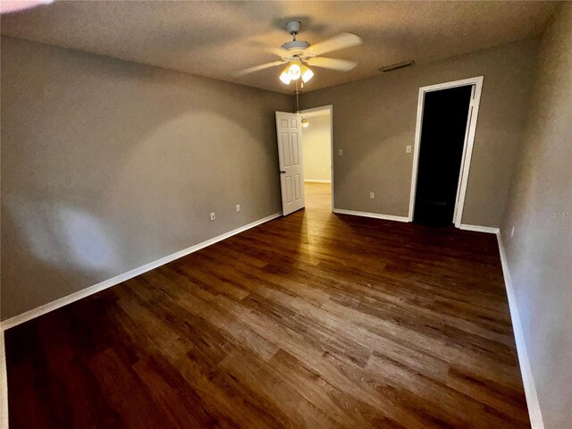 unfurnished room featuring a textured ceiling, wood-type flooring, and ceiling fan