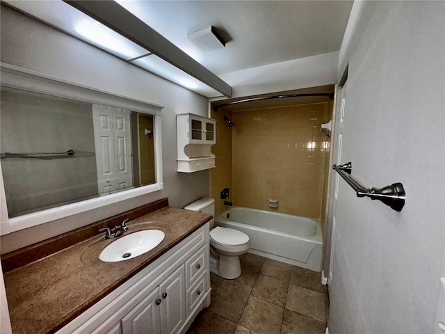 bathroom featuring washtub / shower combination, tile patterned flooring, vanity, and toilet