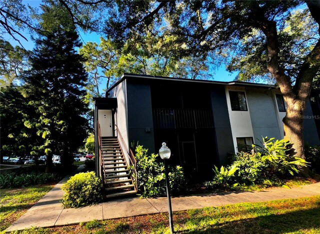 view of outbuilding featuring stairway