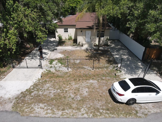 single story home featuring fence