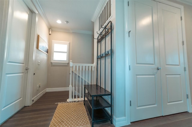 stairway with wood-type flooring and ornamental molding